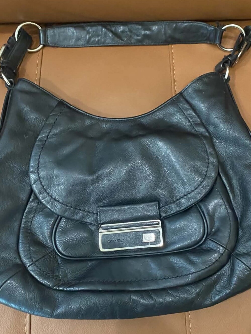 Calvin Klein black leather shoulder/hobo-style handbag.